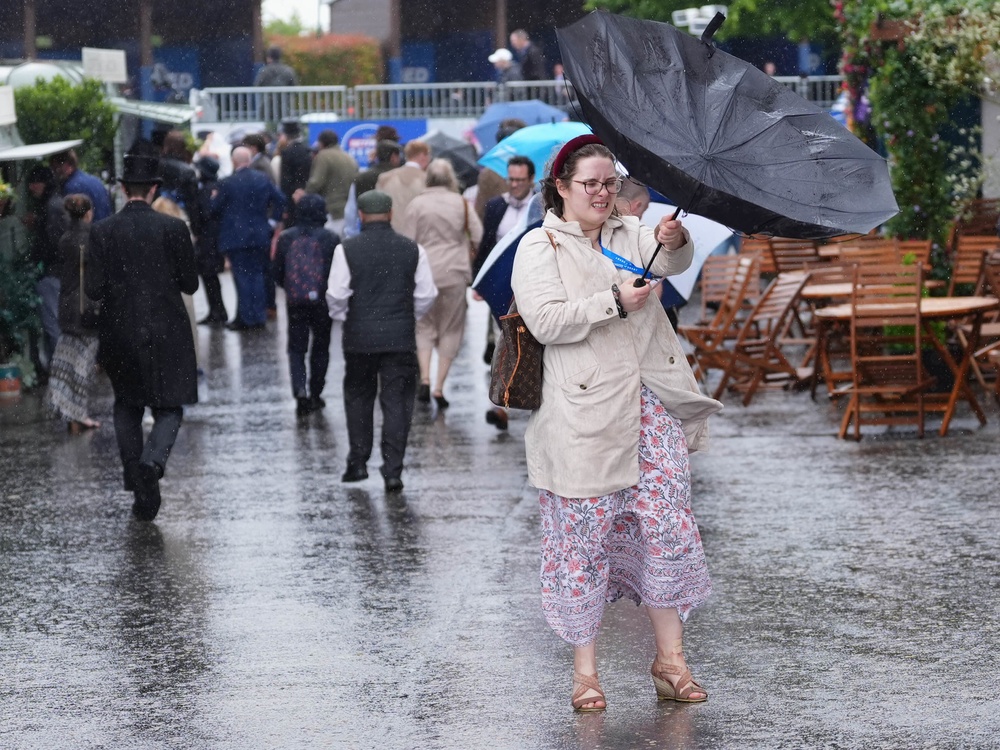 Racegoers had to contend with wind and rain during Derby Day at Epsom on Saturday (PA)