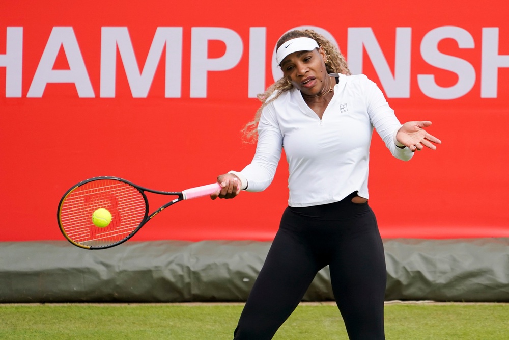 Serena Williams practices at Queen's Club, in London (AP)