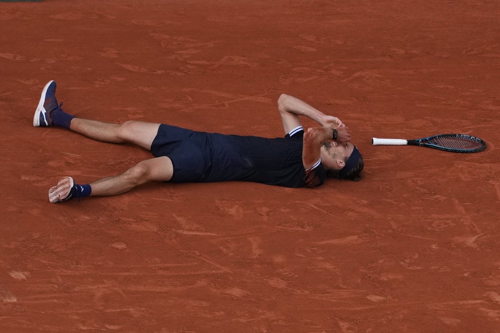 The second seed dropped to the ground as Cobolli's overhead smash went wide (AP)
