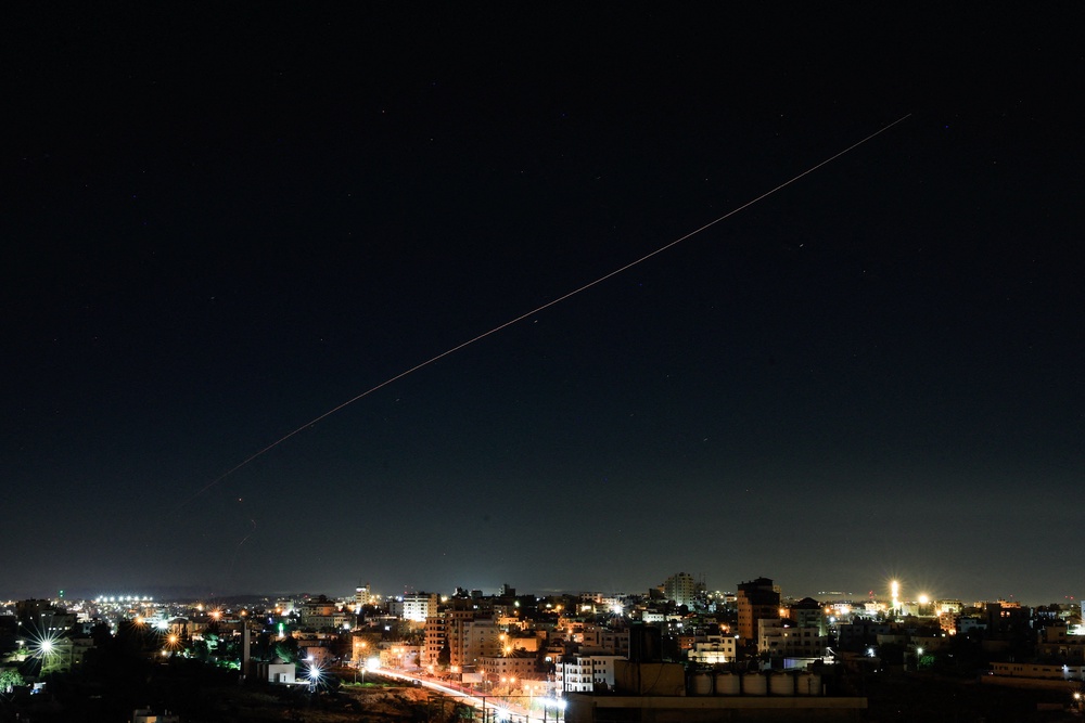 An Iranian missile flies in the sky over Israel, as seen from Hebron, in the Israeli-occupied West Bank, June 7 (Reuters)