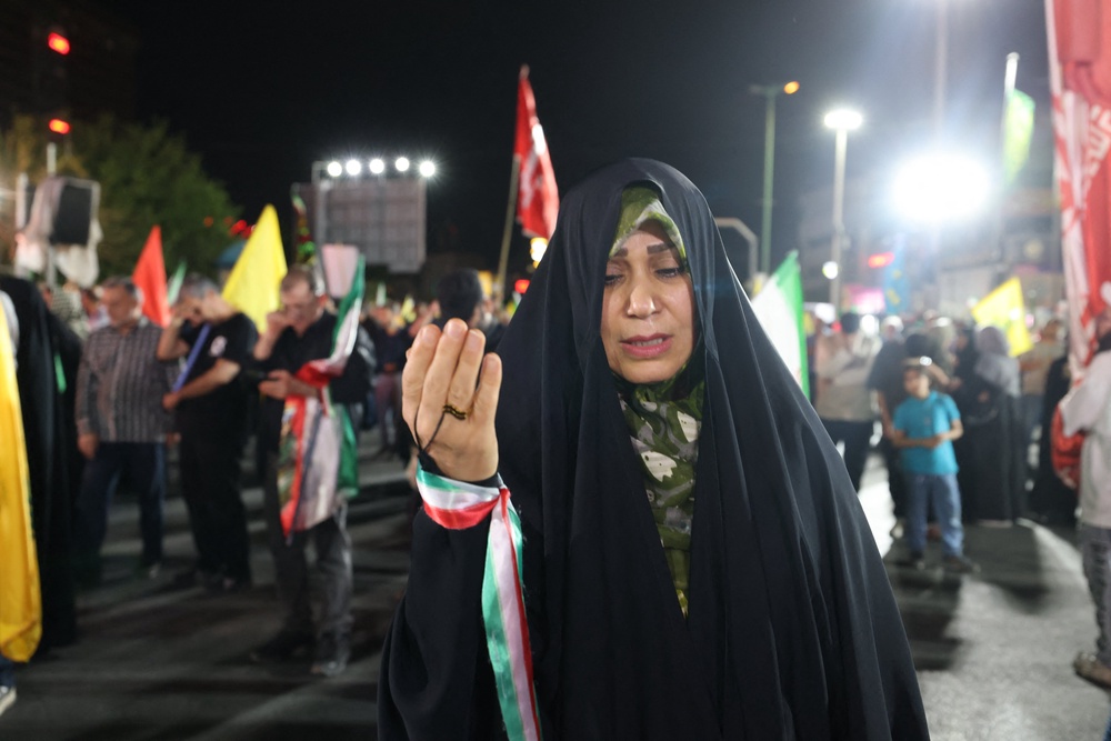 A woman takes part in a pro-government demonstration in Tehran on Sunday (AFP/Getty)
