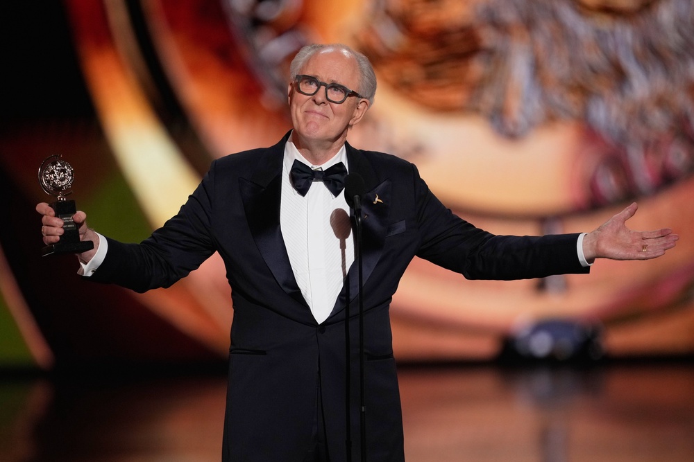 John Lithgow accepted the award for best performance by a leading actor in a play for ‘Giant’ (AP)