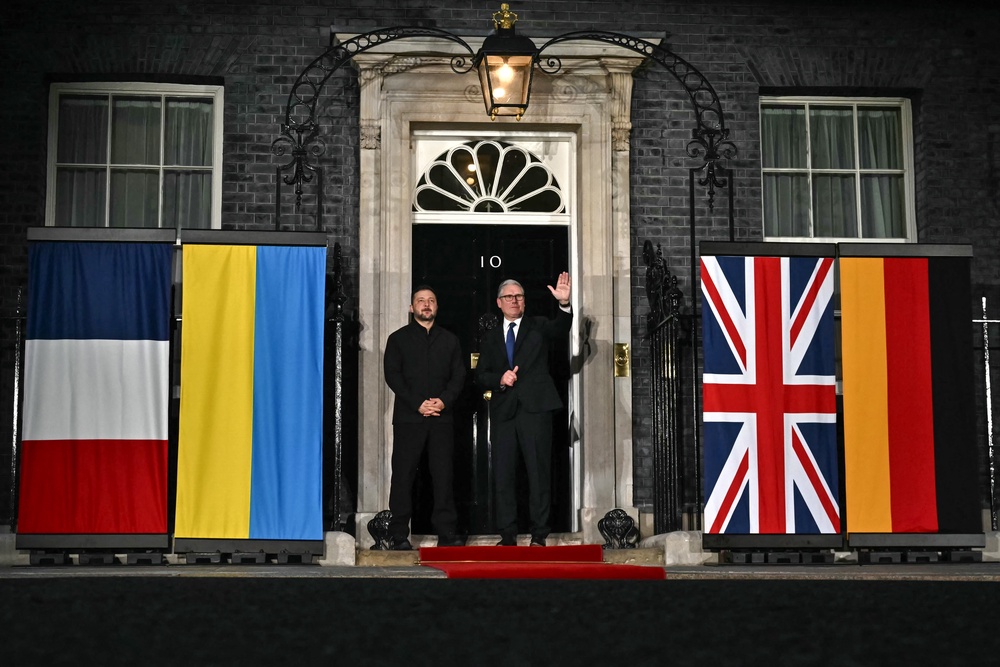 Ukraine's president Volodymyr Zelensky and prime minister Keir Starmer wave off Germany's chancellor Friedrich Merz and France's president Emmanuel Macron at 10 Downing Street after their meeting in central London (AFP/Getty)