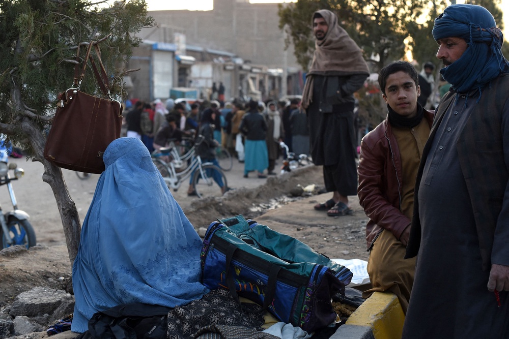 A woman wearing a burqa at a market in Herat in 2022 (AFP/Getty)