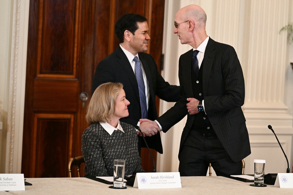 Secretary of State Marco Rubio shakes hands with NBA Commissioner Adam Silver during a roundtable to 