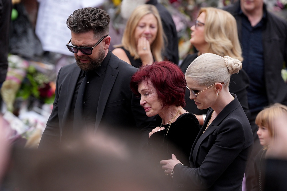 From L-R: Jack, Ozzy and Kelly Osbourne at Ozzy's funeral in July (Getty)