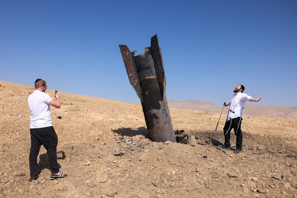 A fallen rocket half-buried in the ground on the outskirts of Jericho on June 8, following Iranian and Iran-backed Houthi rebel attacks (AFP/Getty)