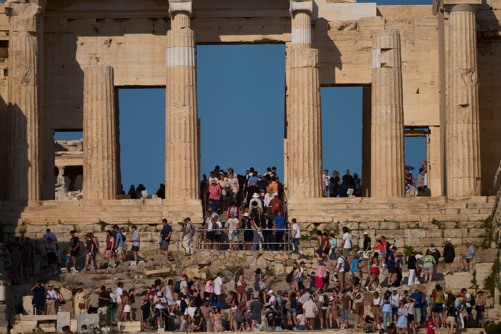 Tourists pictured at the Propylaea on the Acropolis Hill in May (AP)