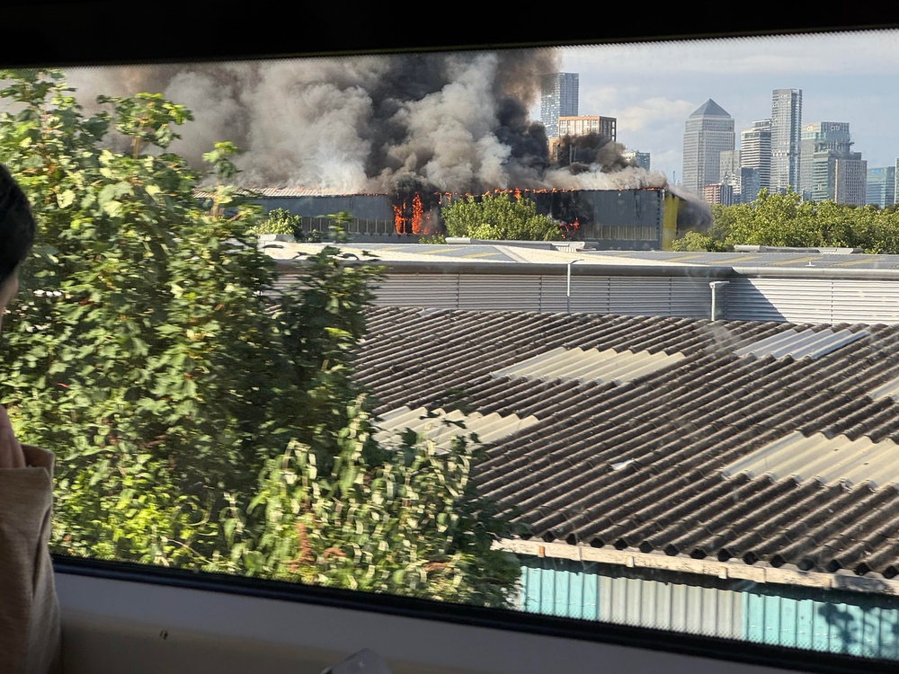 Smoke and flames from the site of a major fire in London, as seen from a train from London Bridge (Annabel Lawrence)