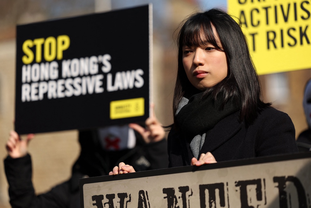 Activists take part in a protest marking the first anniversary of the implementation of Hong Kong’s national security law in central London on 19 March 2025 (AFP/Getty)