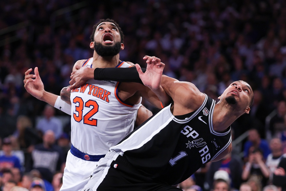 Victor Wembanyama #1 of the San Antonio Spurs and Karl-Anthony Towns #32 of the New York Knicks battle for position (Getty)