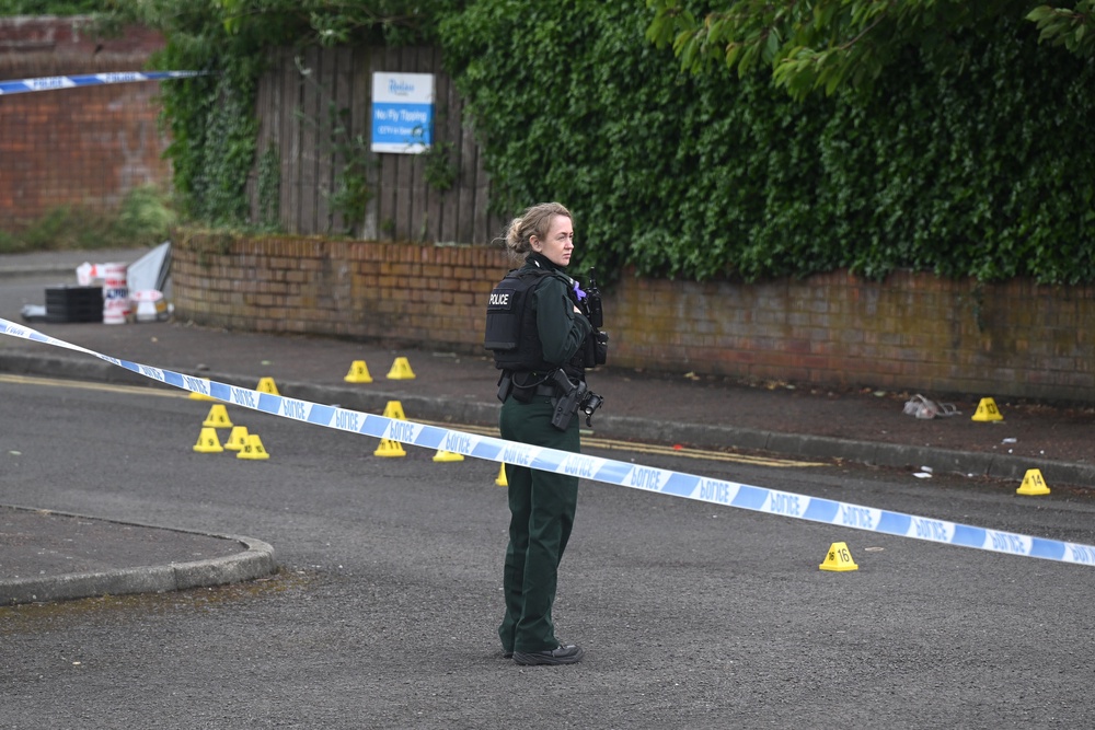 Police attend the scene following a stabbing attack in North Belfast (Getty)