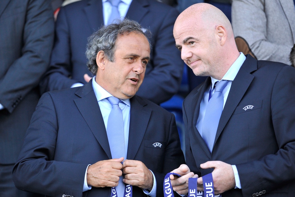 Michel Platini (left) has launched a criminal complaint towards Gianni Infantino (Getty)