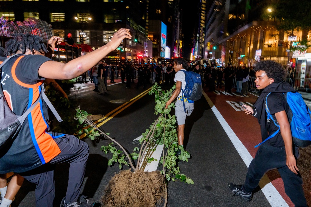 Potted plants were dragged through the streets and bus stop signs used a weapons (Getty)