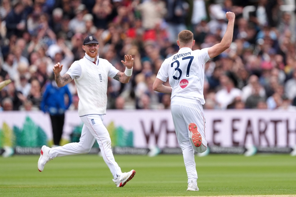 Gus Atkinson celebrates with Stokes after taking a wicket on Sunday (Ben Whitley/PA) (PA Wire)