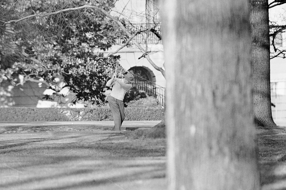 President Dwight Eisenhower brushes up on his golf game near the putting green on the lawn of the White House, Jan. 13, 1959, in Washington (AP Photo/HB)