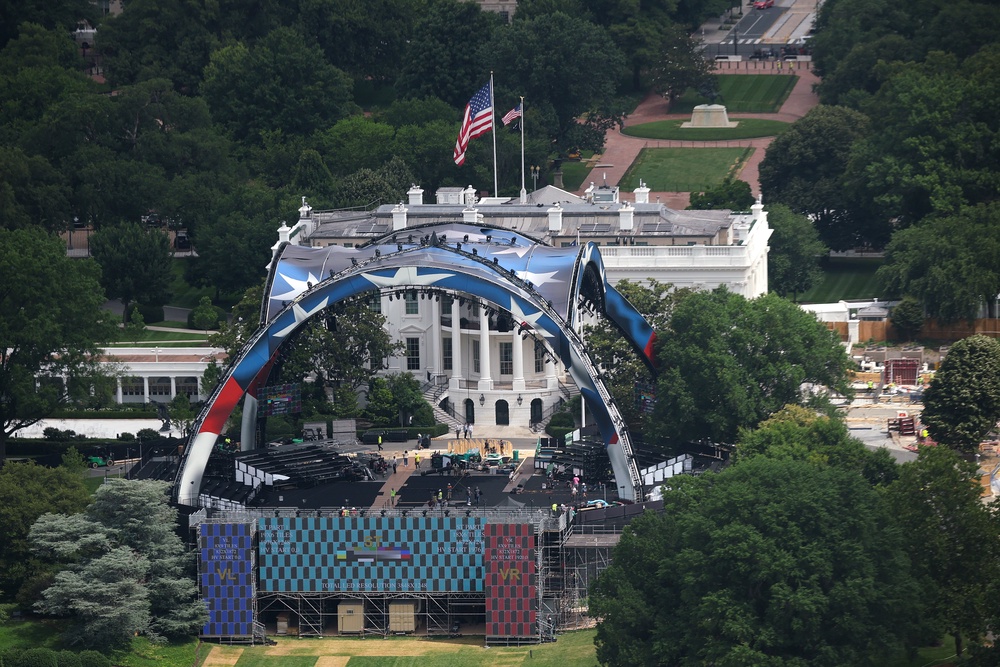 Workers build the outdoor UFC arena on the South Lawn of the White House which is expected to cost the parent company of the fighting organization $60 million to pull off (Getty)