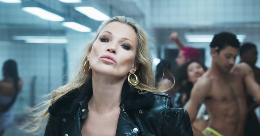 Moss moment: The legendary British model Kate Moss turns up to Madonna’s party (YouTube/Warner Records)