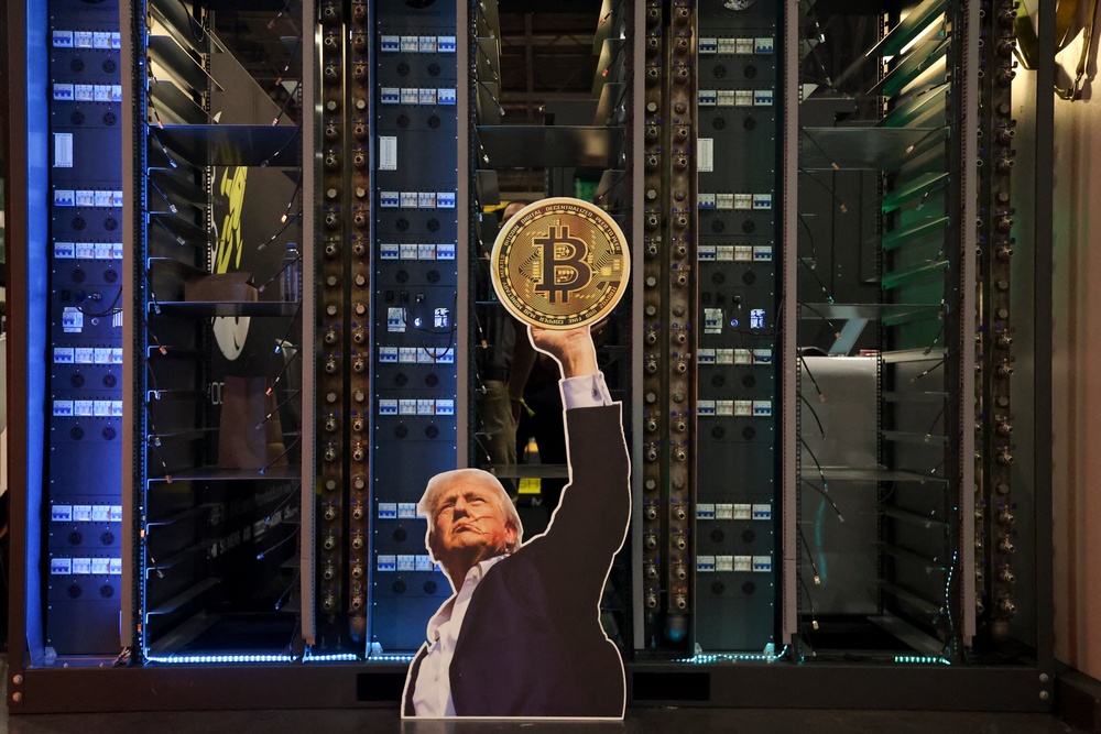 A cutout of President Donald Trump holding a Bitcoin is displayed in front of computer servers during The Bitcoin Conference in Las Vegas, on May 27, 2025 (AFP/Getty)