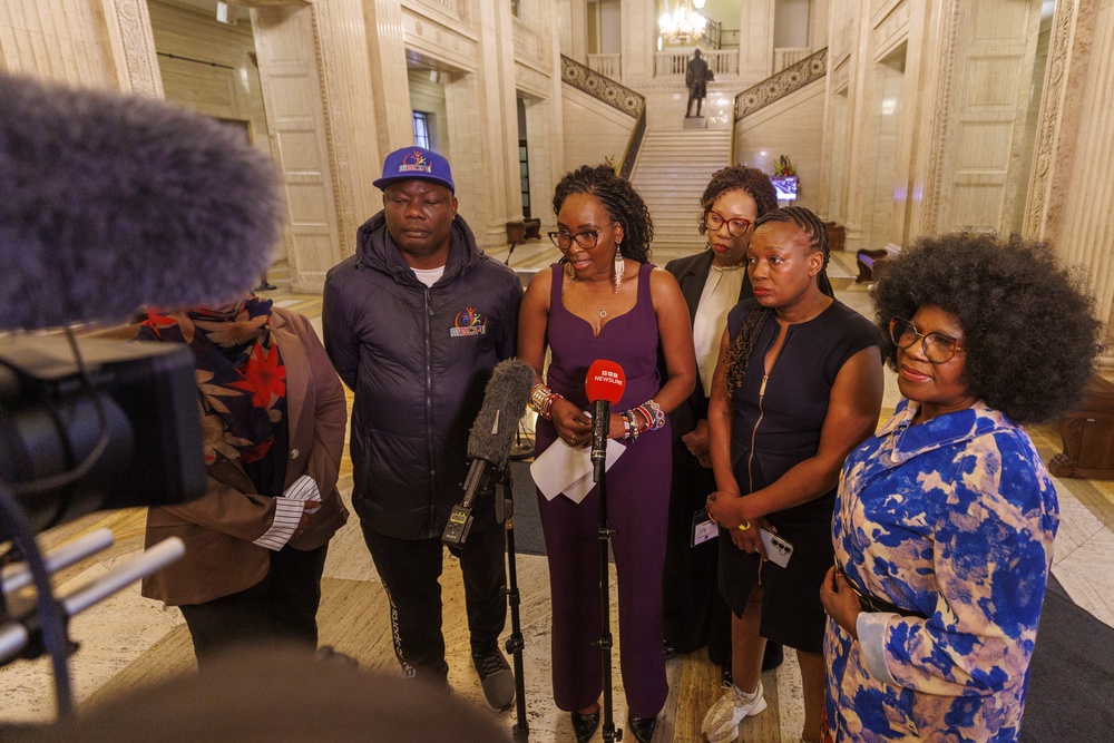 Lilian Seenoi-Barr (centre) speaking to the media at Parliament buildings at Stormont on Tuesday (Liam McBurney/PA) (PA Wire)