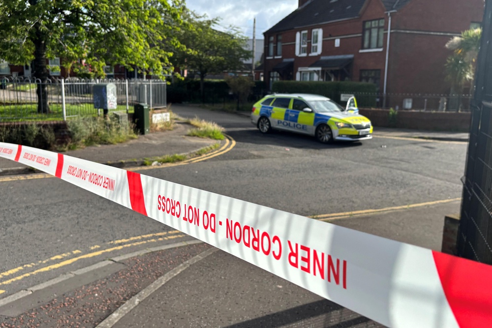 A police cordon at the scene of a stabbing outside apartments in the Kinnaird Avenue area of north Belfast (PA Wire)
