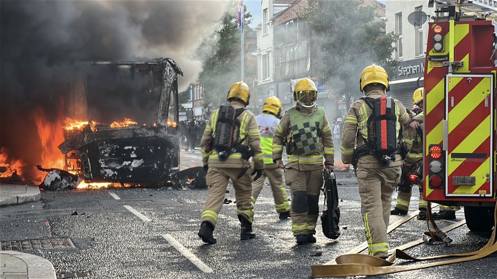 Emergency services attend to a bus fire (PA) (PA Wire)