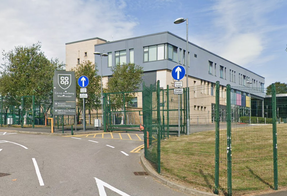 Three people were injured in the attack at Co-op Academy in Manchester (Google Maps)