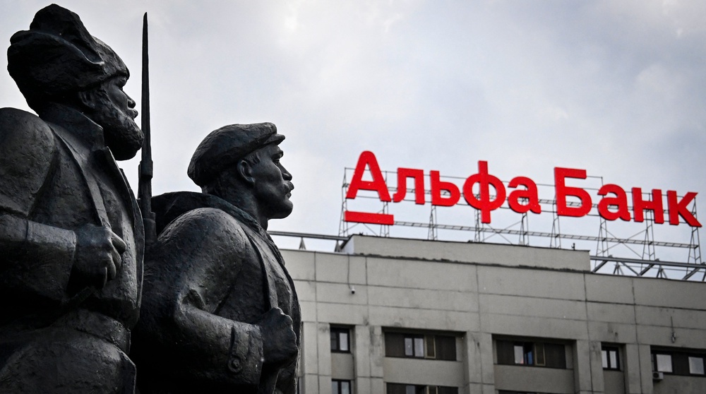 The logo of Alfa Bank, Russia's privately-held lender is seen atop of a building behind revolutionary militiamen in Moscow (AFP/Getty)