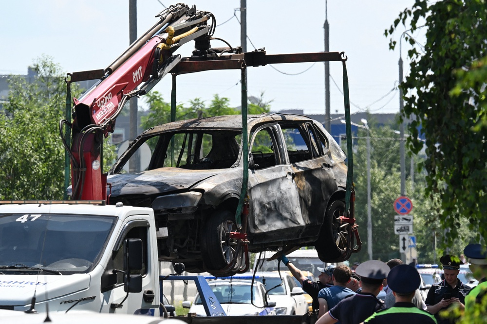 The wreckage of a car is loaded onto the platform of a truck after a blast caused by an explosive device killed its driver in Balashikha outside Moscow (AFP/Getty)