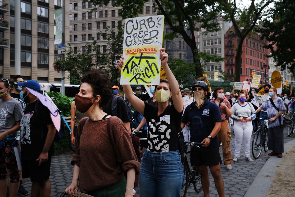 A ‘march on billionaires’ protest in May 2020 in New York City. That chasm between the ultra-rich and workers is widening. Nearly a third of America’s wealth is held by 1 percent of the population, according to Inequality.org (Getty)