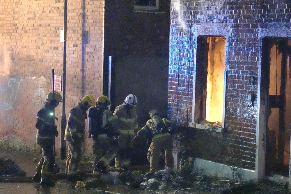 Firefighters attending a house which was set on fire on Ligoniel Road (PA)
