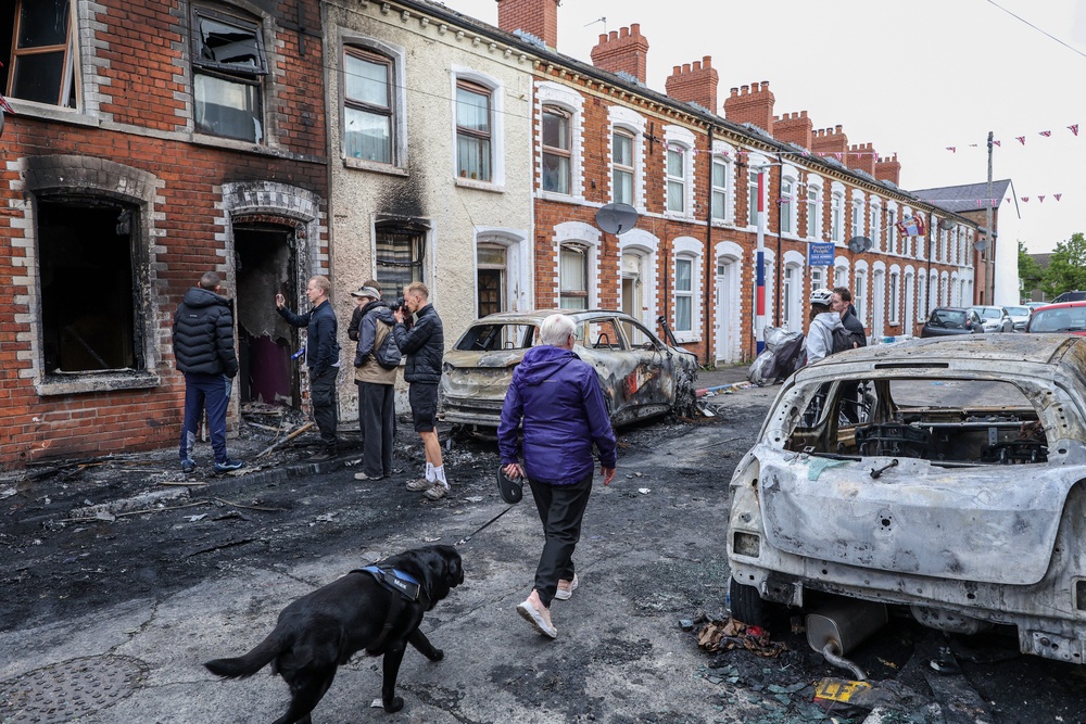 The aftermath of a riot that saw cars and homes targeted (AFP/Getty)