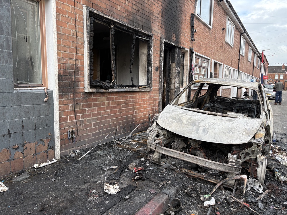 Burned out cars and houses on Lendrick Street in east Belfast (PA) (PA Wire)
