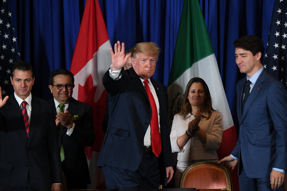 Freeland applauds Trump after signing a new free trade agreement in Buenos Aires in 2018 (AFP/Getty)