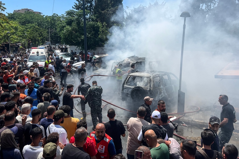 A car on fire after an Israeli airstrike on Sidon (AFP/Getty)