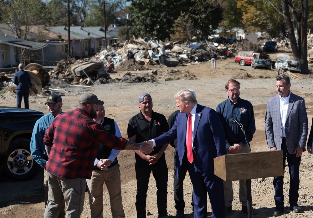 In the past, Trump has called for FEMA to be radically overhauled or dismantled. Pictured: Trump visits with local officials and residents affected by Hurricane Helene in 2014 (Getty Images)