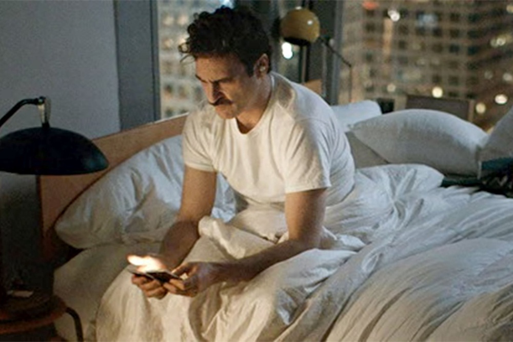 Joaquin Phoenix stars in Spike Jonze’s ‘Her’ as a man who falls in love with an AI operating system, which was initially voiced by Morton before her role was recast and given to Scarlett Johansson (Warner Bros)
