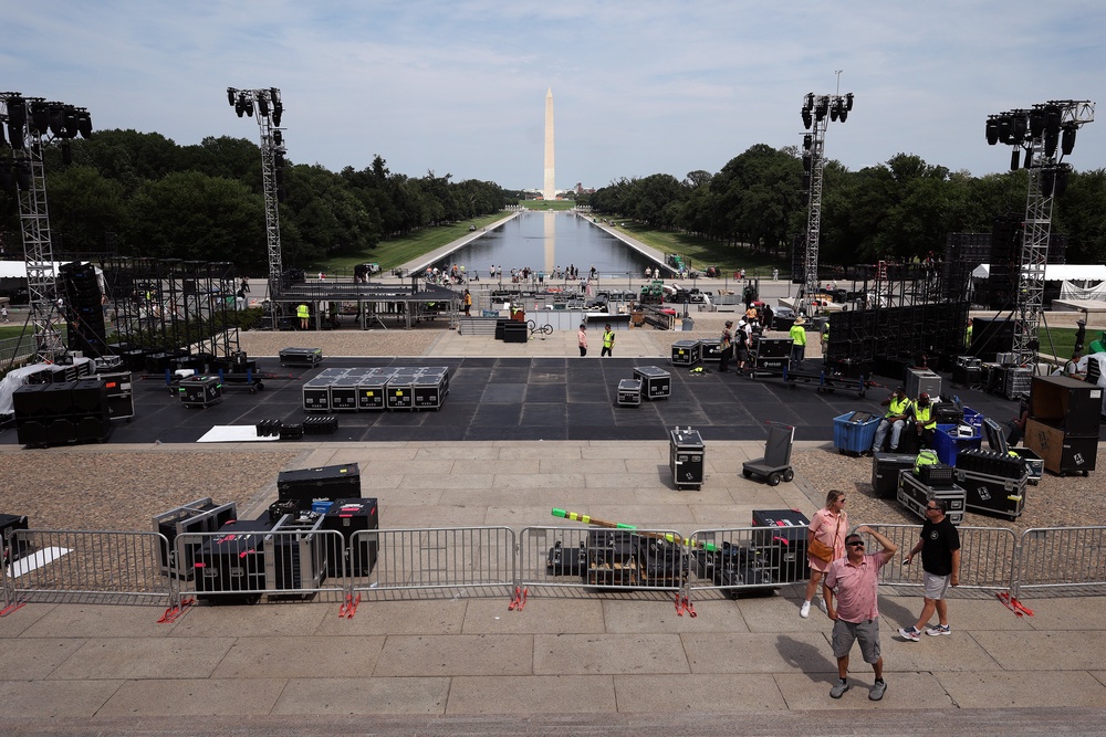 View from the stairs of the Lincoln Memorial shows crews setting up stage lights, temporary fencing and other equipment in advance of the UFC Freedom 250 press conference (Getty)