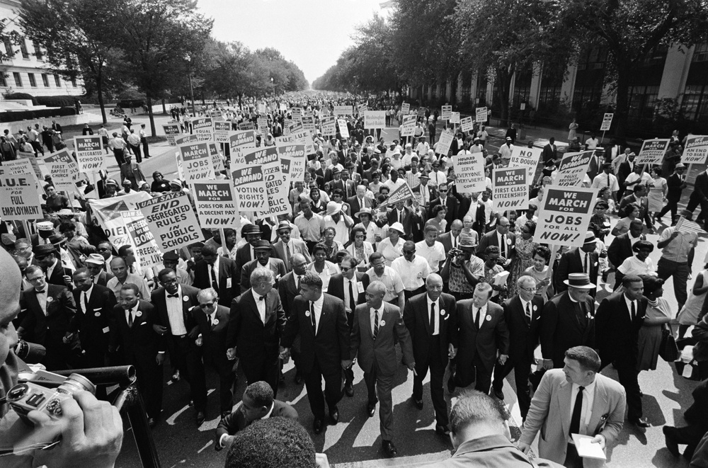 The Rev. Martin Luther King Jr. (3rd L) and other black and white civil rights leaders lead the 