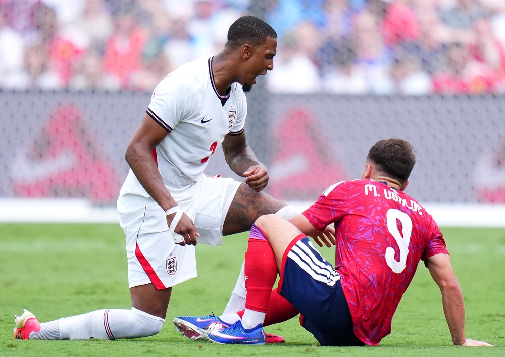 Konsa goes down under pressure from Ugalde. (Getty Images)
