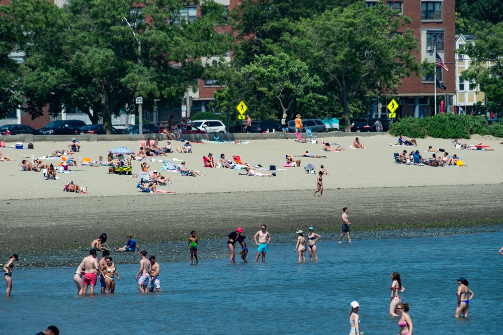 Visitors enjoy a summer day at Carson Beach in Boston, which can be reached using the city’s T Red Line (AFP/Getty)