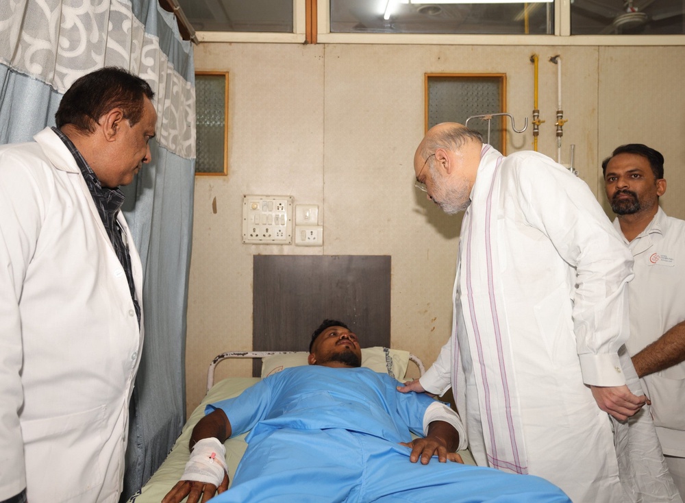 Home Affairs Minister Amit Shah meeting Mr Ramesh at a hospital in Ahmedabad after the plane crash (Ministry of Home Affairs India/PA) (PA Media)