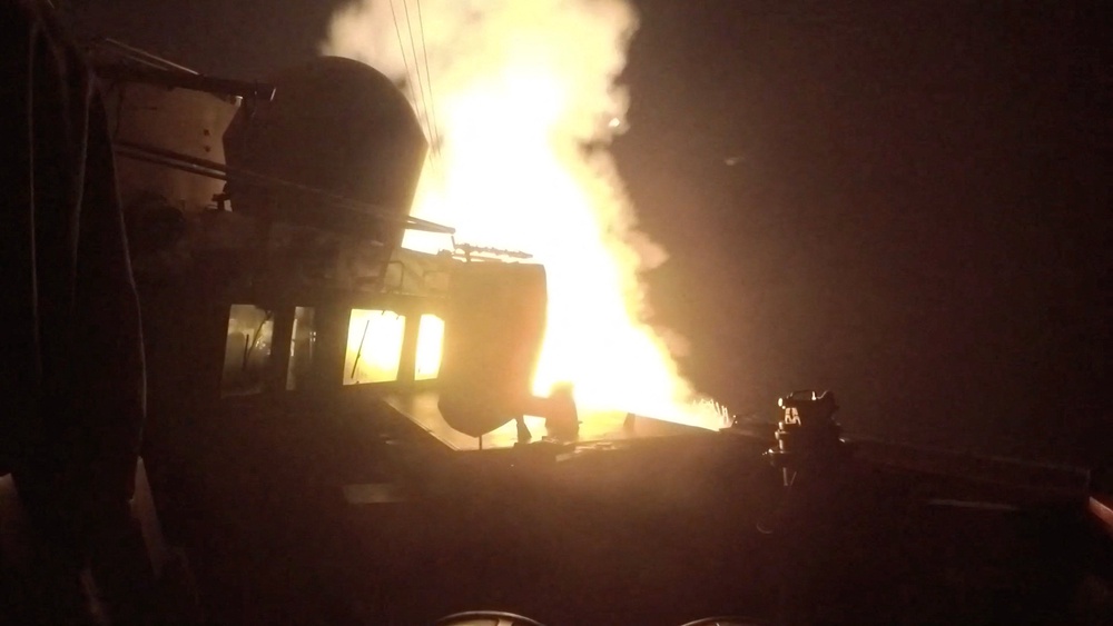 USS Michael Murphy (DDG 112) launches Tomahawk cruise missiles from an unknown location (Reuters)