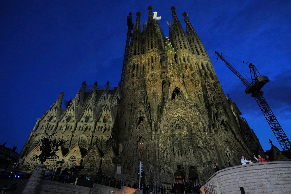 Pope Leo XIV, background right, blesses faithful during the inauguration ceremony of the Tower of Jesus Christ at the Basilica of the Sagrada Familia (AP)