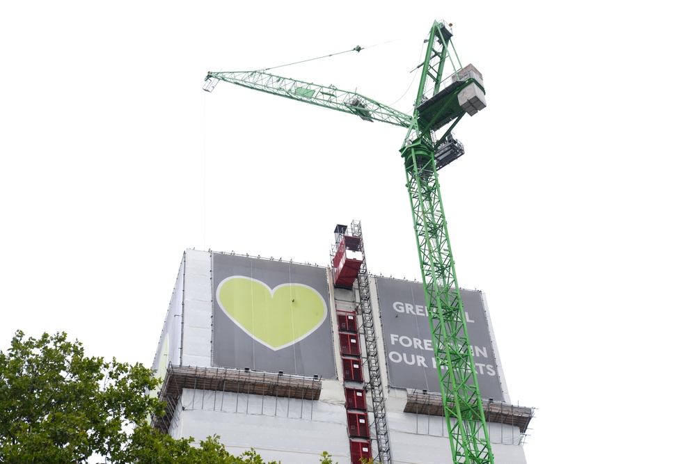 A crane over the Grenfell Tower where demolition work is underway (PA)