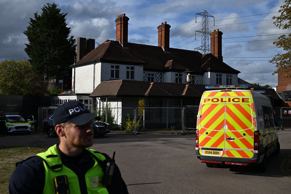 Police officers secure the site where protesters calling for the closure of The Bell Hotel which houses asylum seekers, start to gather outside, in Epping, northeast of London, on August 31, 2025. (AFP/Getty)