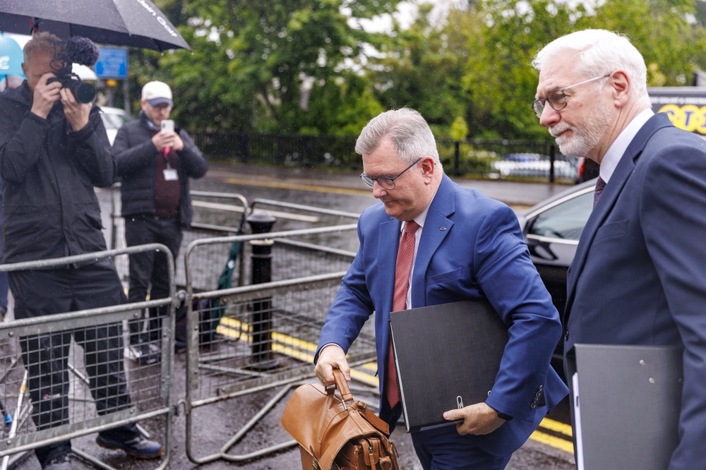 Sir Jeffrey Donaldson (centre) arriving at Newry Crown Court (Liam McBurney/PA) (PA Wire)