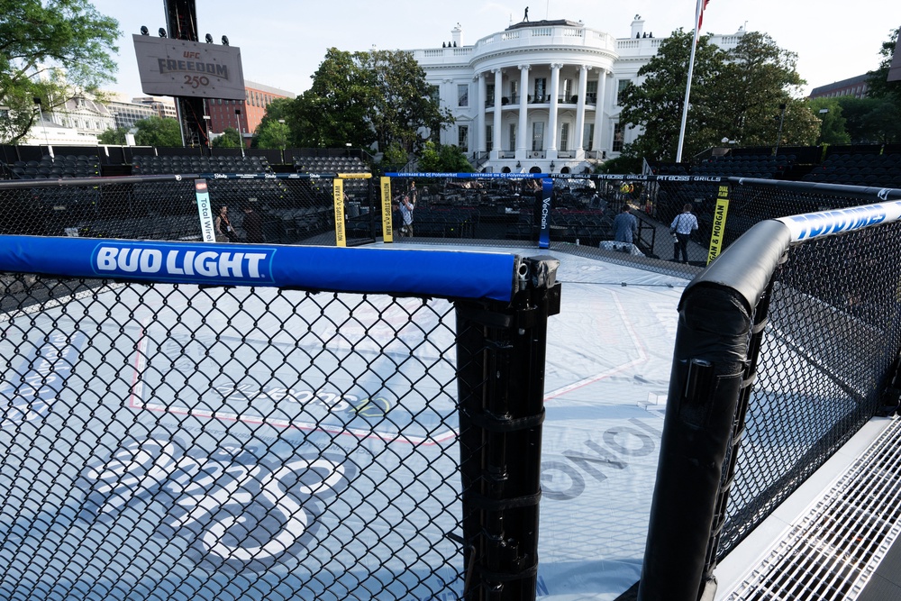 The octagon features branding from companies that partner with UFC, such as Bud Light and Polymarket, in addition to the event’s sponsors, Crypto.com and Ram Trucks (AFP/Getty)