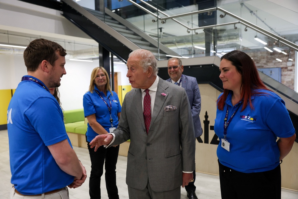 Charles meets members of staff during his visit to Horizon Youth Zone (Temilade Adelaja/PA)