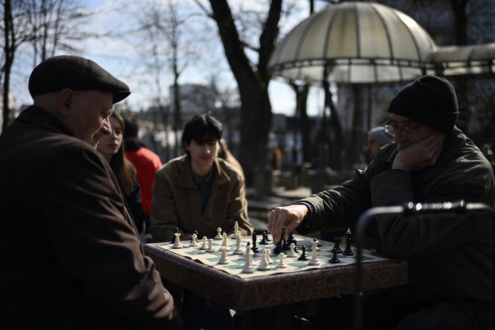 People play chess at a park in central Kyiv on March 25, 2026, amid the Russian invasion of Ukraine (AFP/Getty)